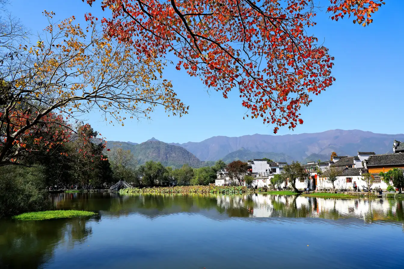 Traditional Chinese village, ancient village, misty mountains, tranquil lakes, traditional architecture, rich cultural heritage